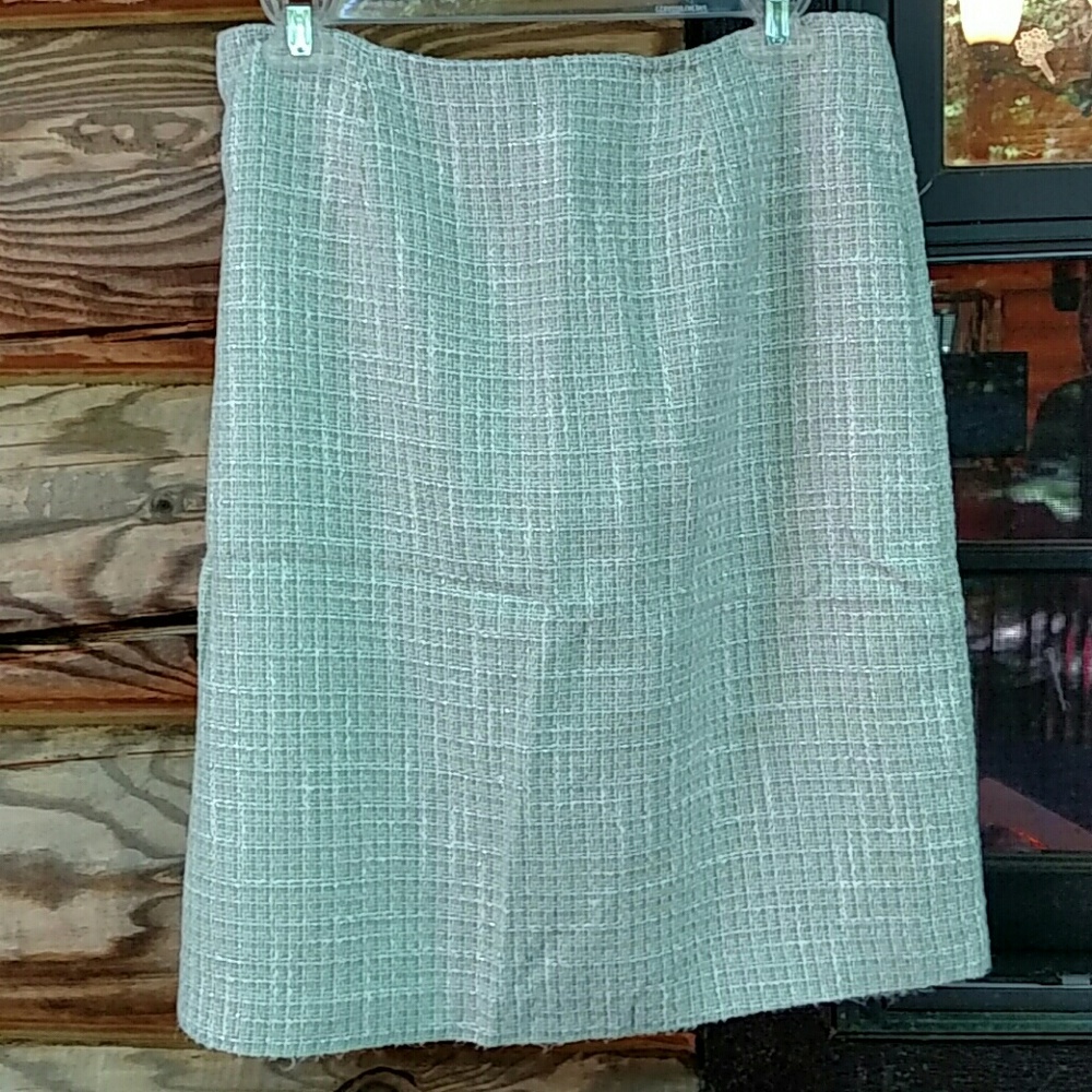 Green skirt with silver threads throughout. Size 8